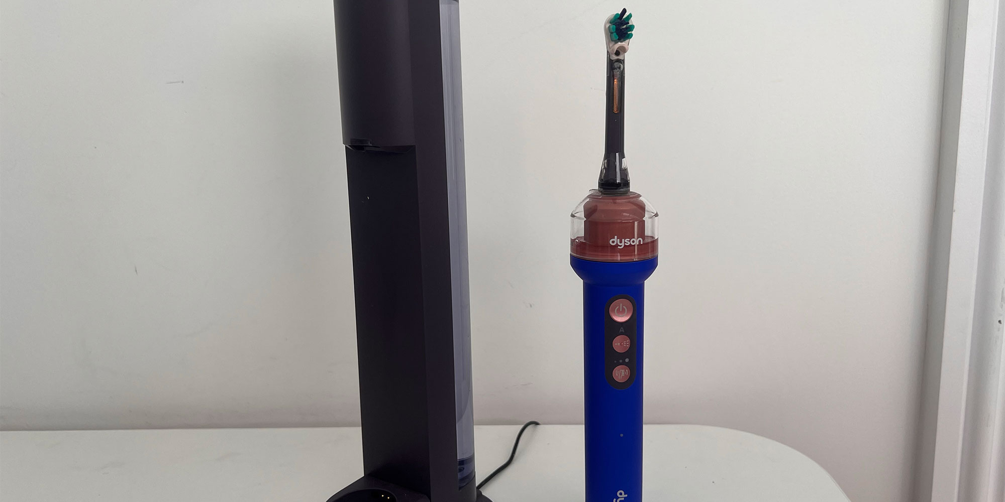 Dyson CameraJet toothbrush and charging doc