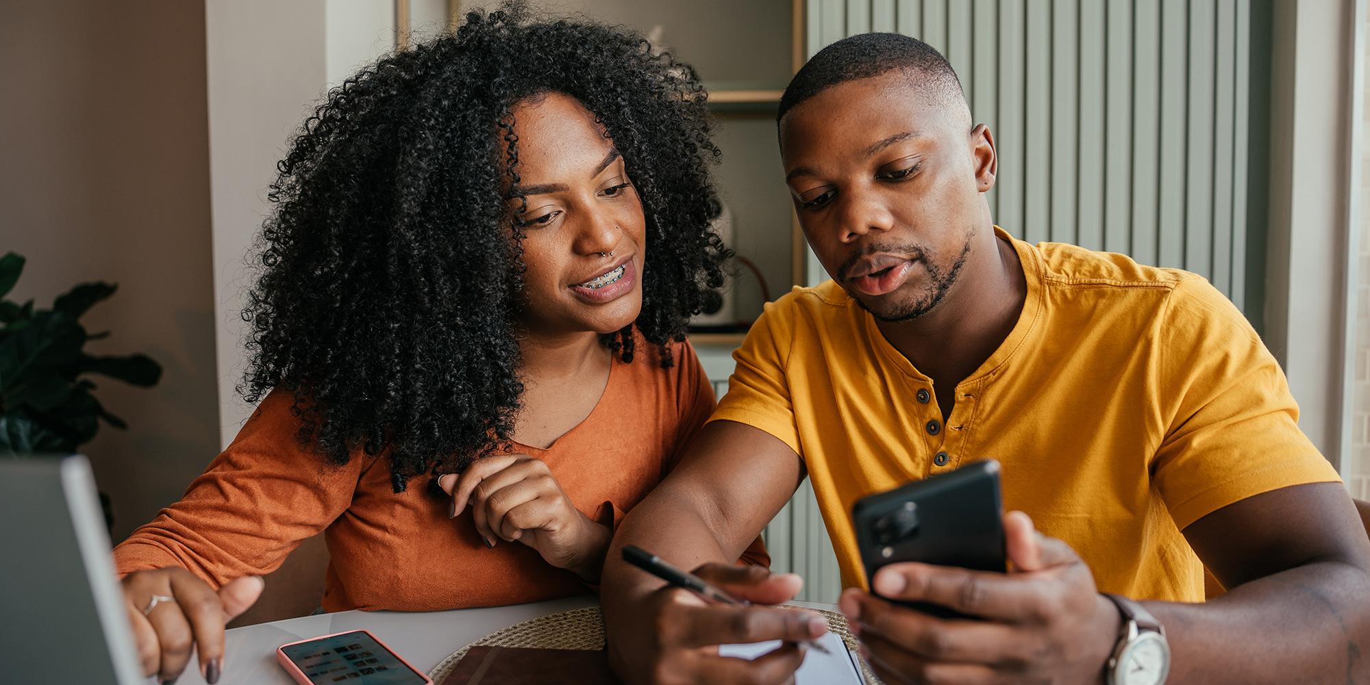 Two people managing their finances