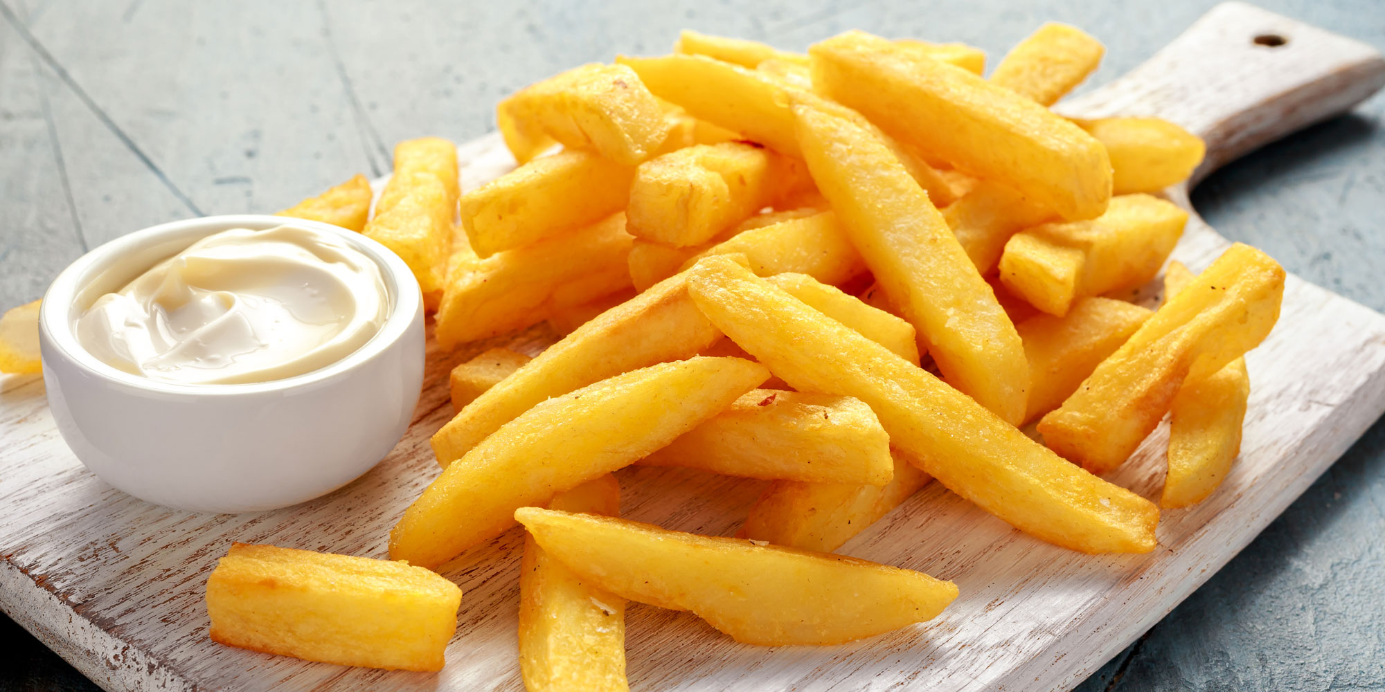 Board with chips and mayonnaise
