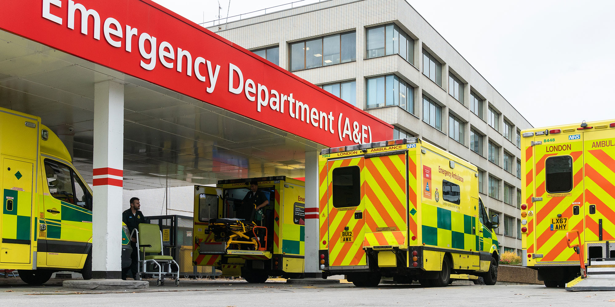 Image of yellow ambulances outside A&E department