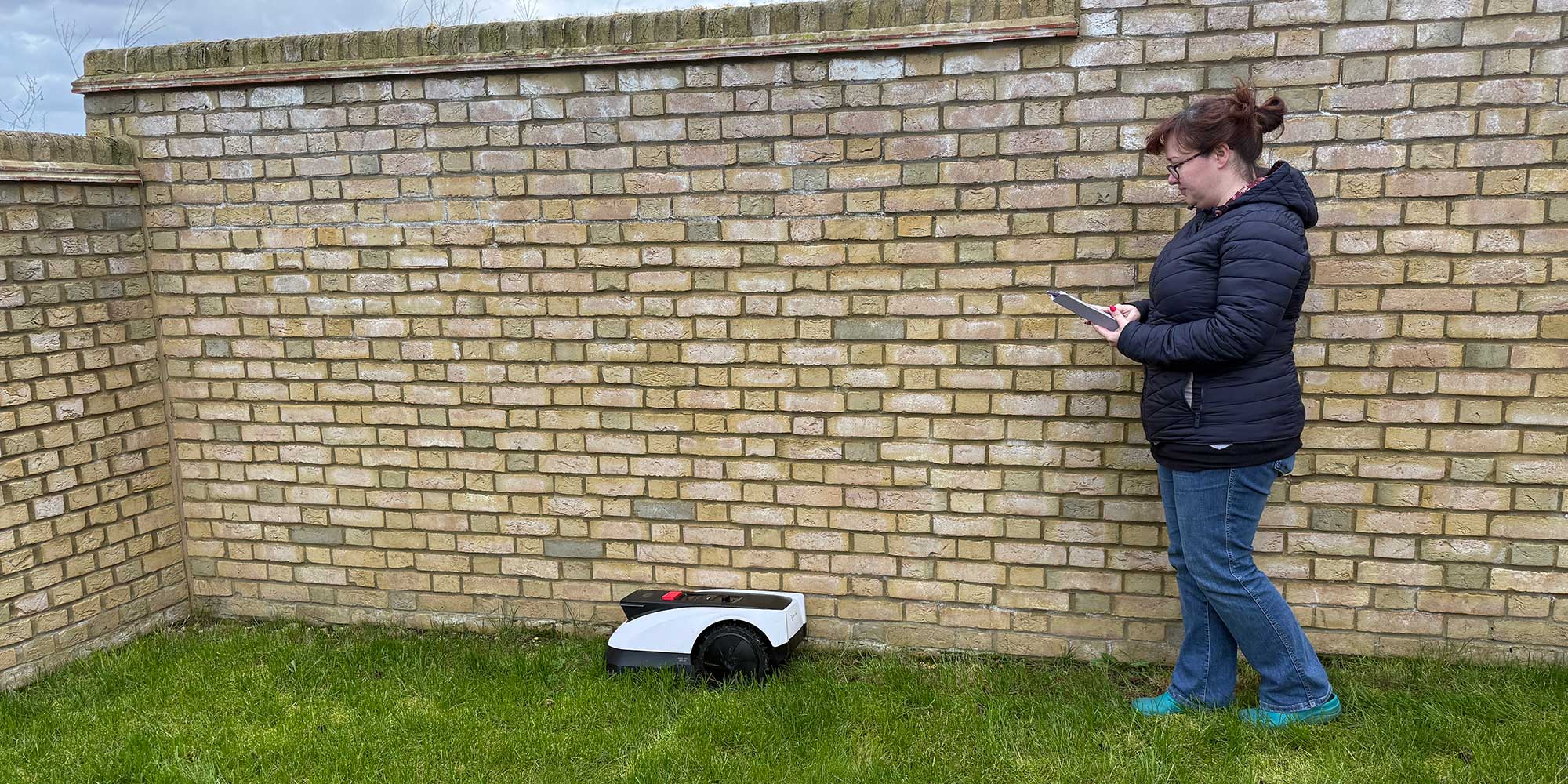 Steph Kipling using a robot lawnmower