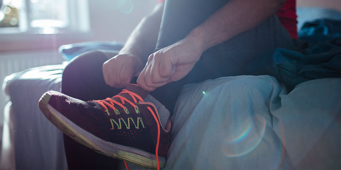 Putting on running shoes