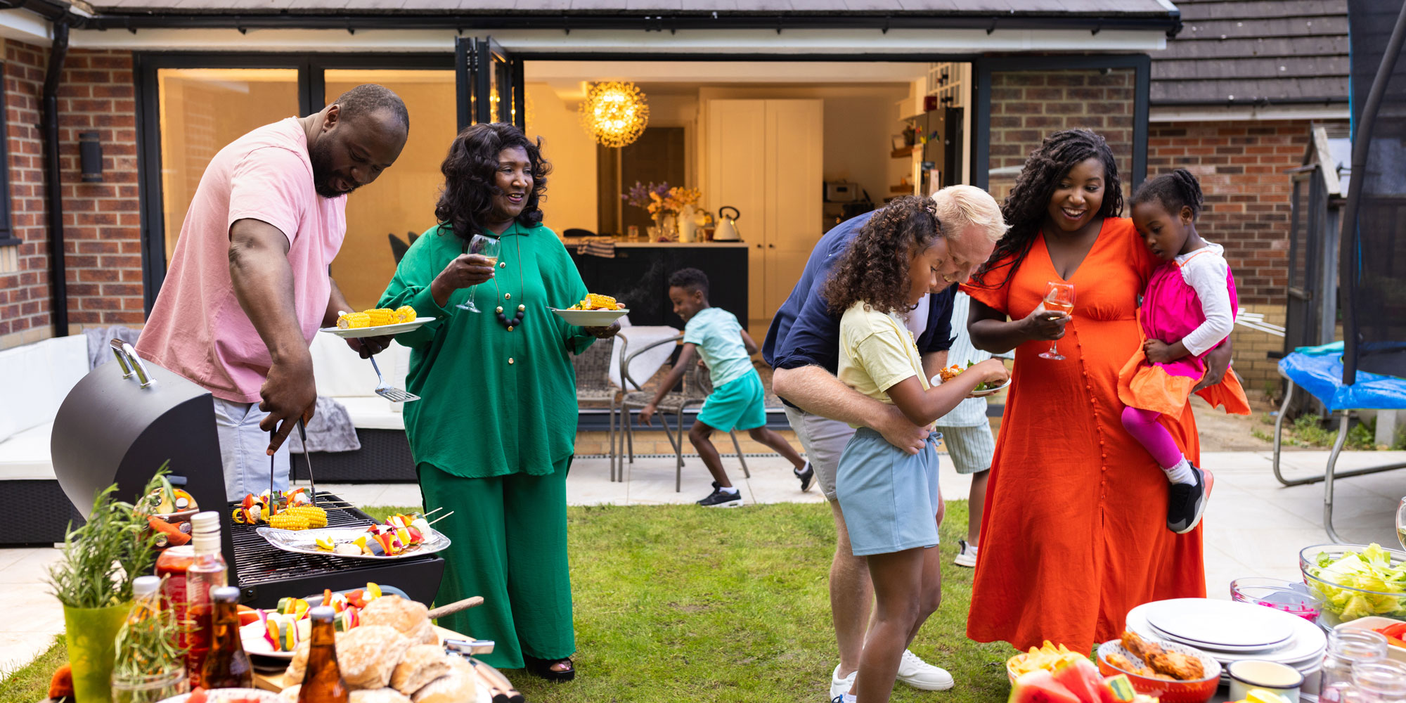 A family socialising in their garden