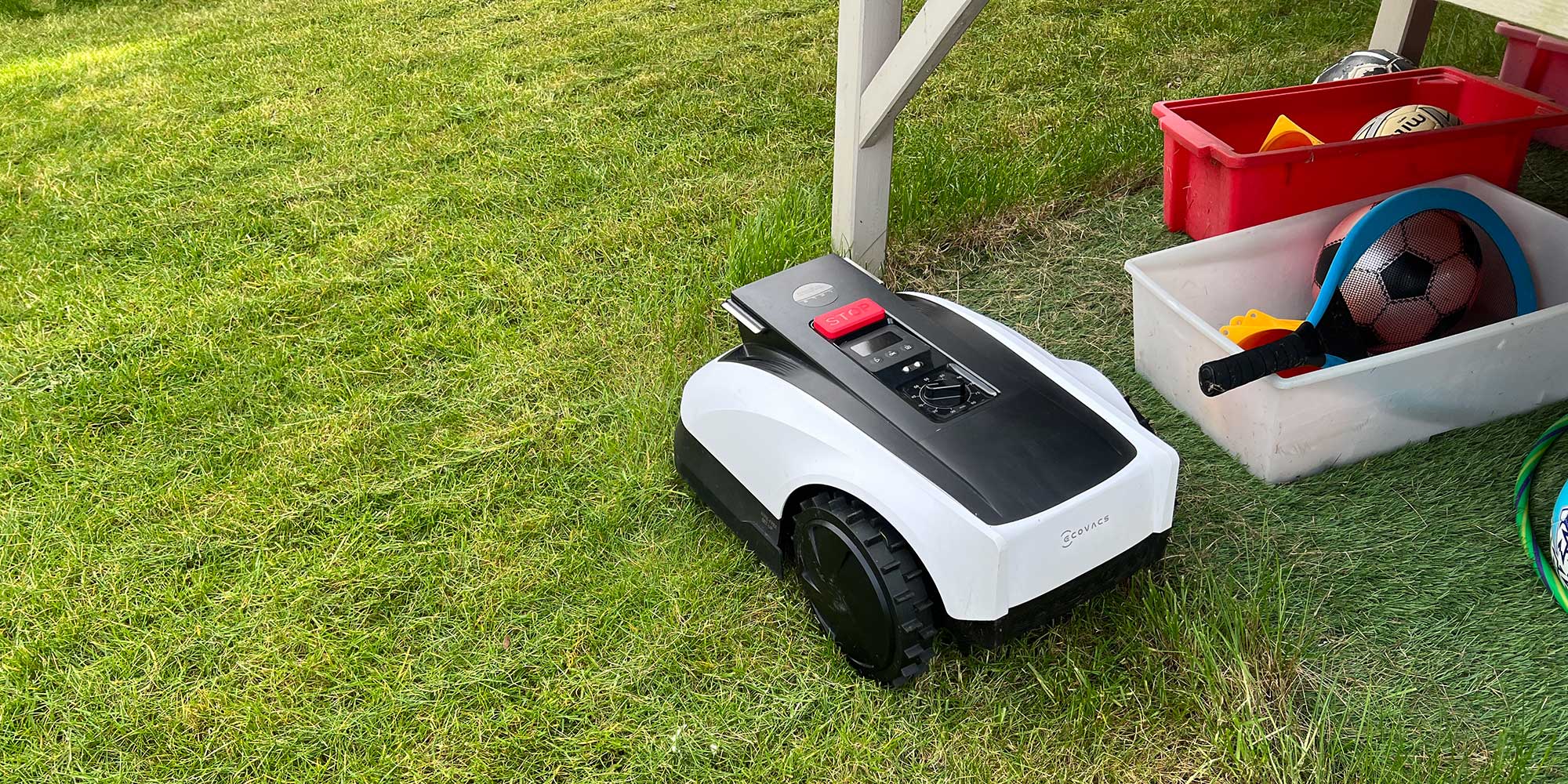 Robot lawn mower in a garden