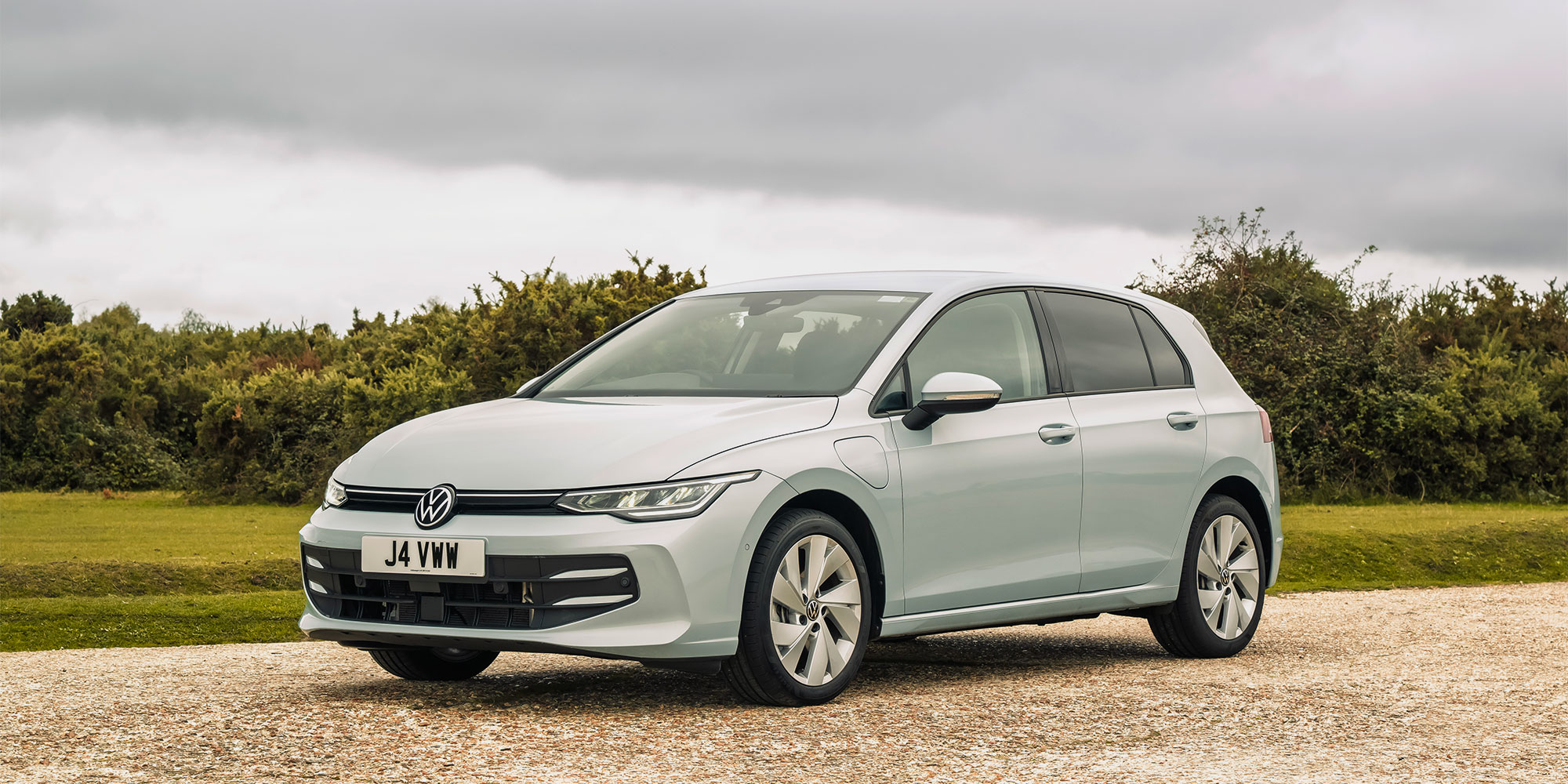 Volkswagen Golf plug-in hybrid parked on a gravel driveway