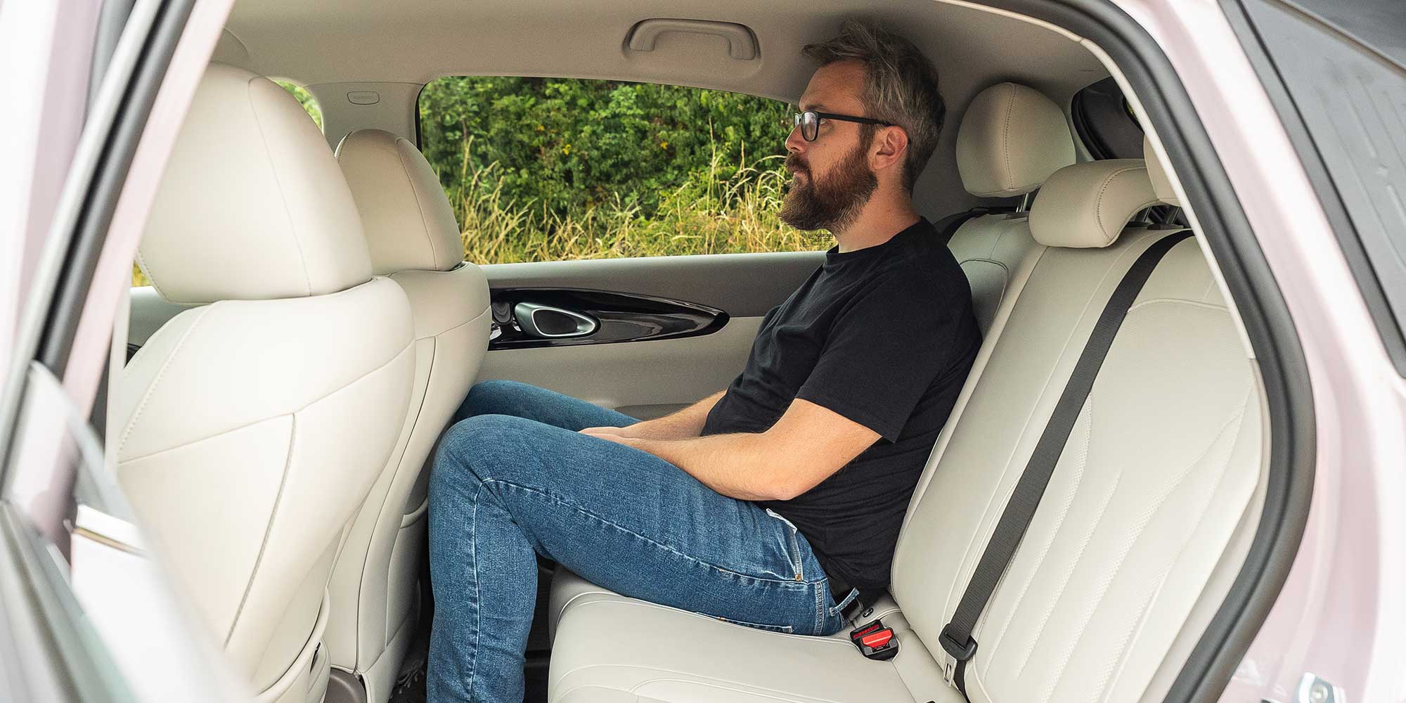 Sitting in the back seat of a Geely EX2
