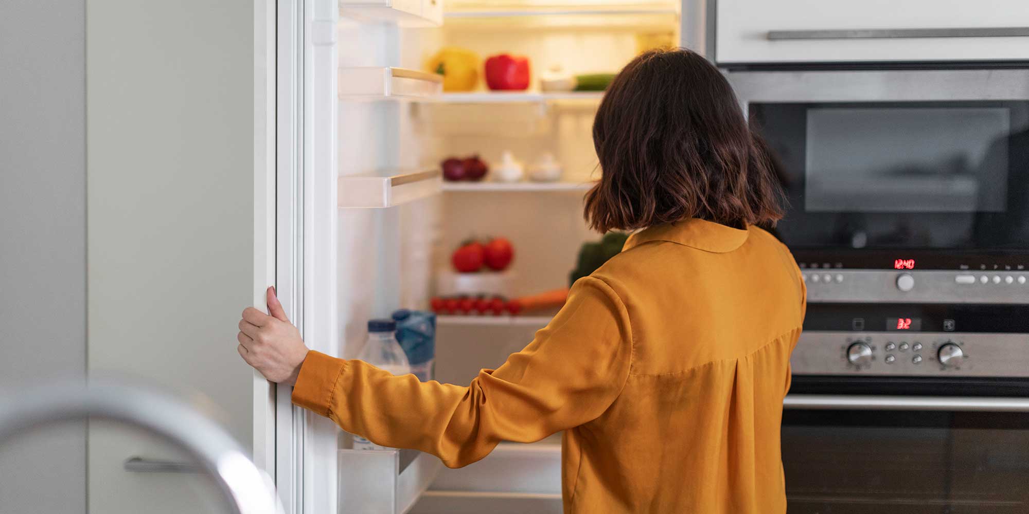 Person opening their fridge freezer