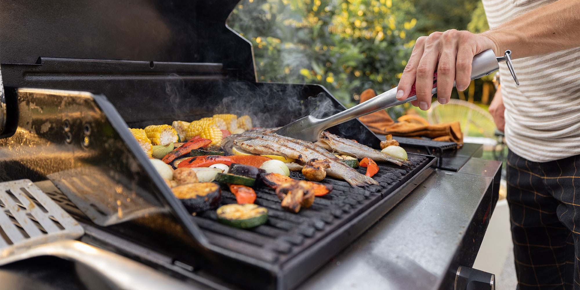 Someone barbecuing food outside