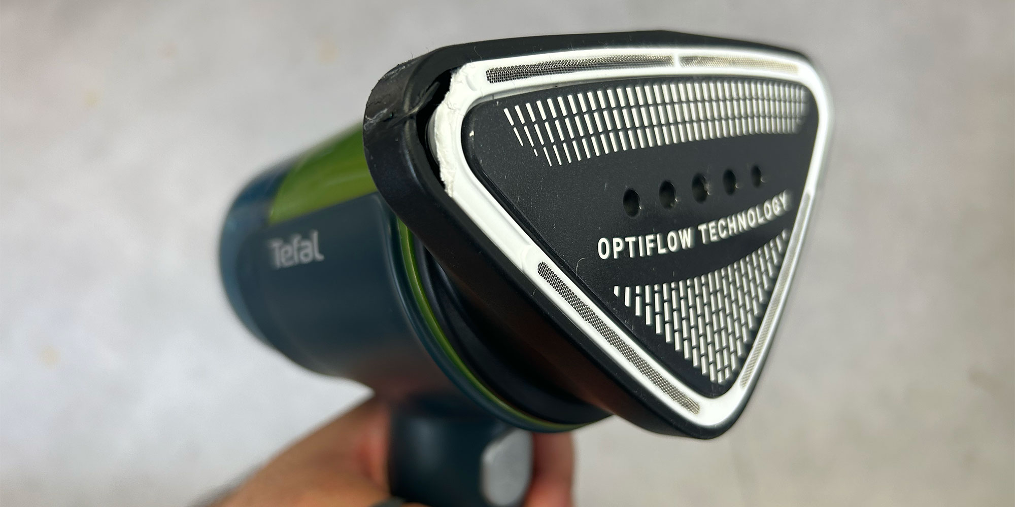 The faceplate of a clothes steamer cracking after being dropped in our durability test.