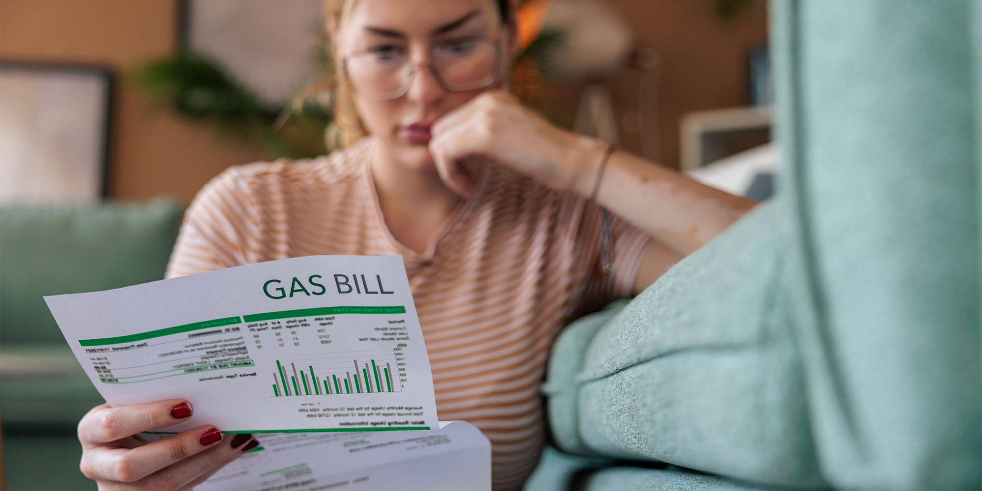 Woman looking at a gas bill