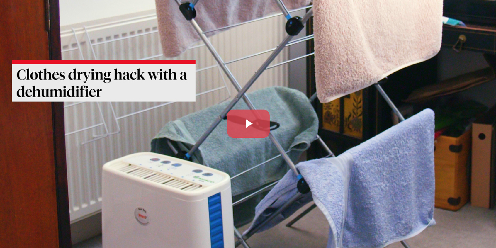 a dehumidifier drying washing on a clothes horse with a caption next to it