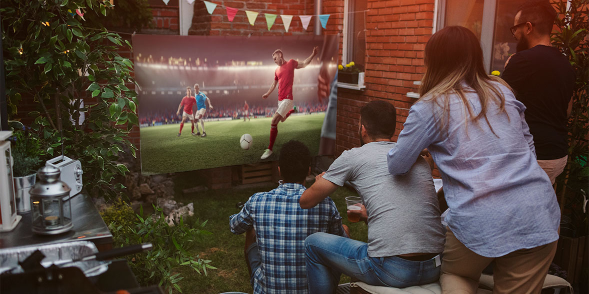 People watching a football match outside