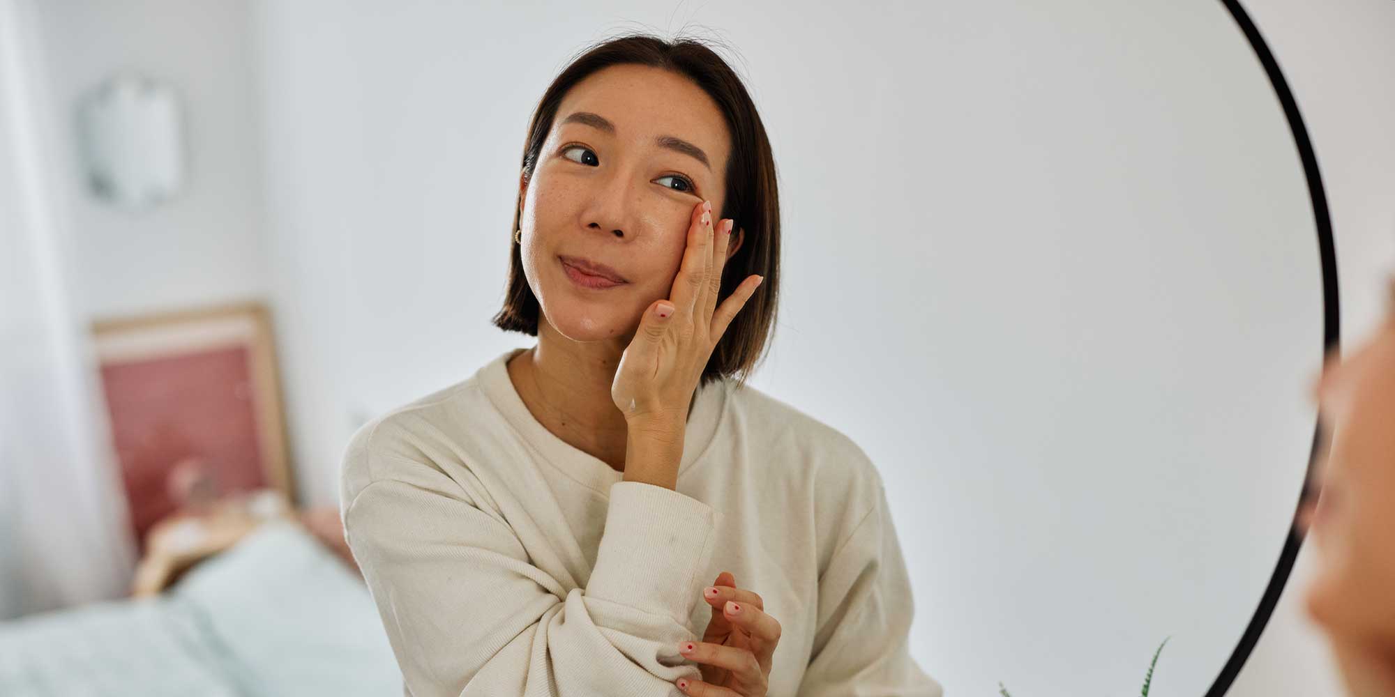 A woman looking in the mirror