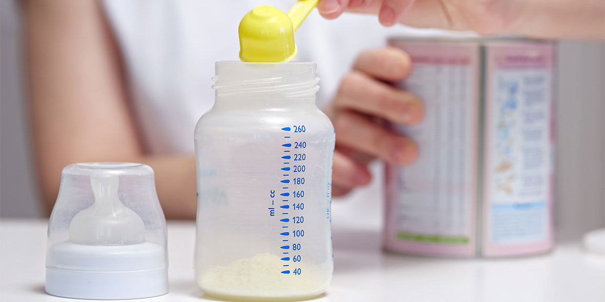 Person mixing formula milk