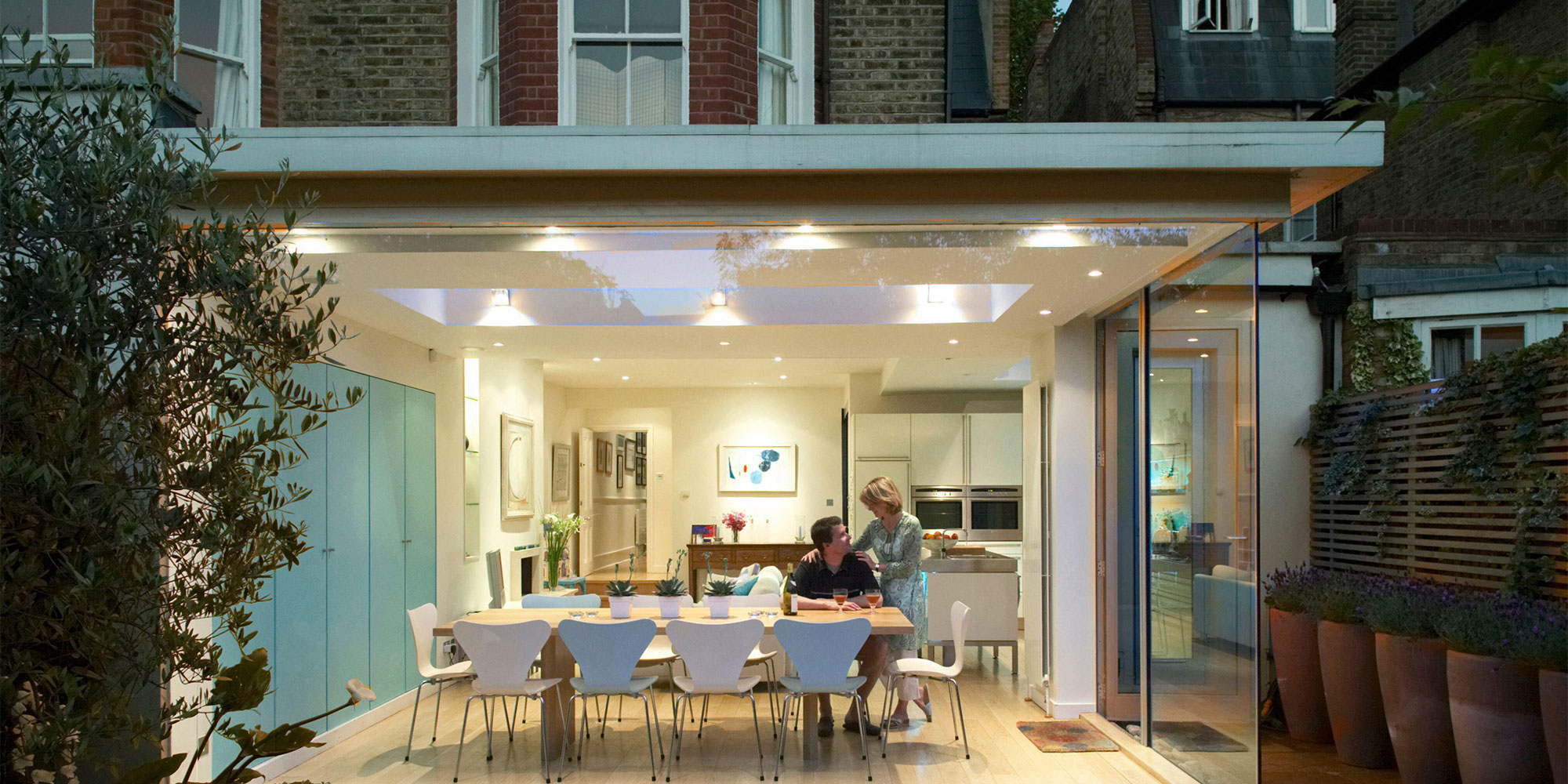 indoor-outdoor kitchen extension with floor-to-ceiling windows