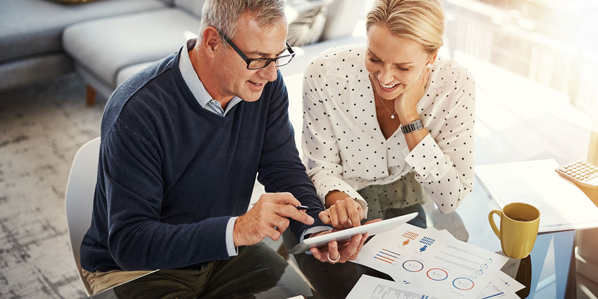 Middle aged couple preparing paper work