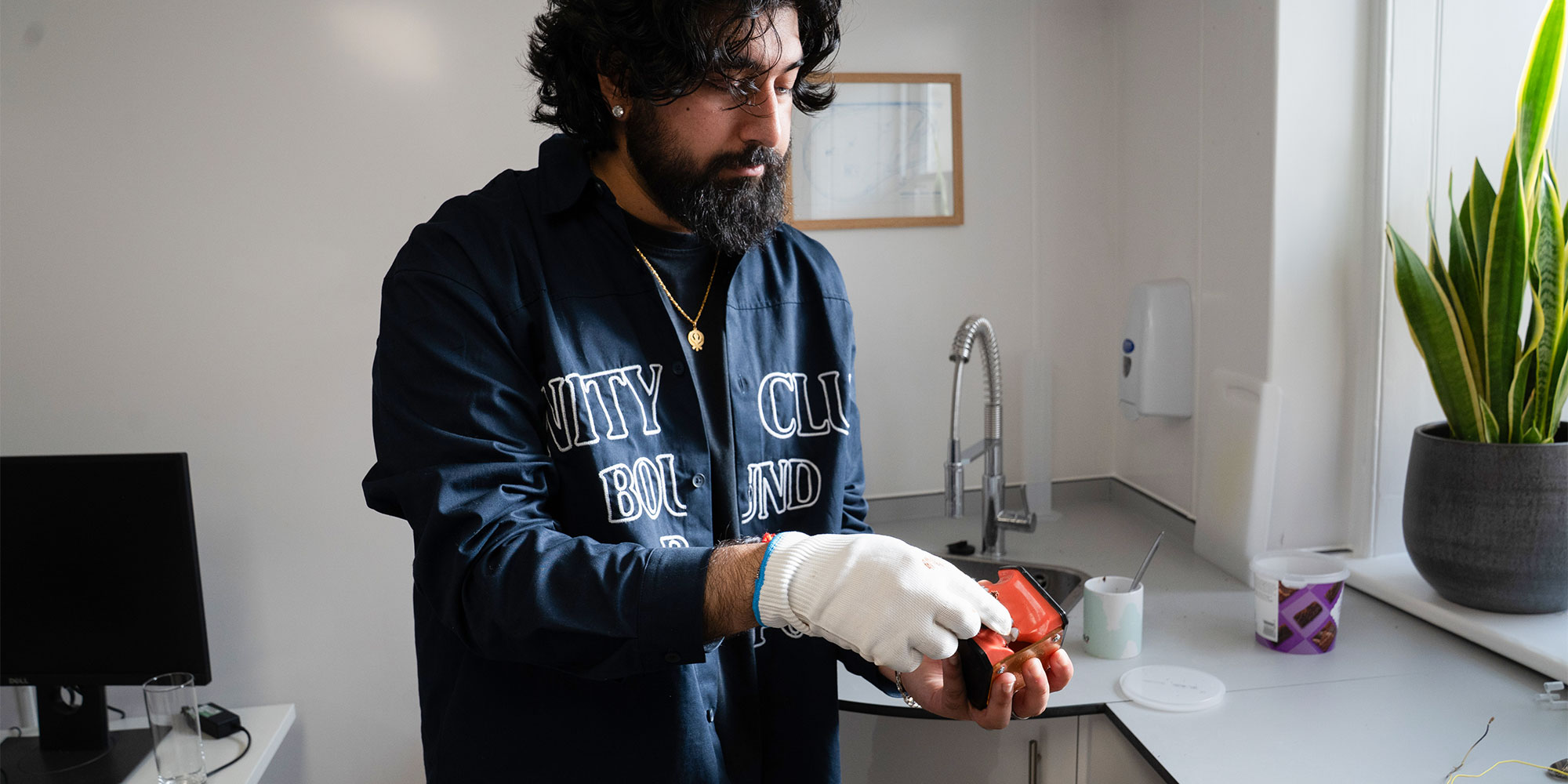 Food is squished down and rubbed across a dental model before being cleaned