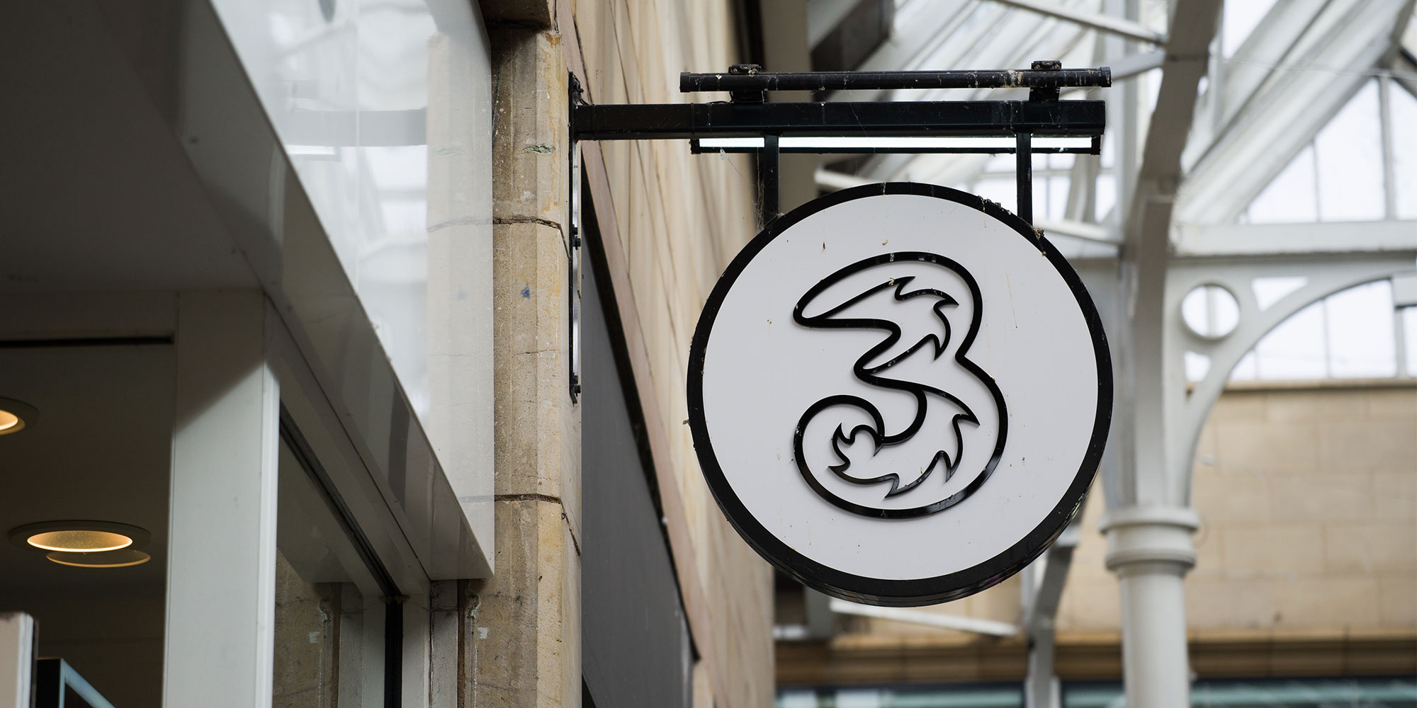 High street sign for Three UK, the mobile network