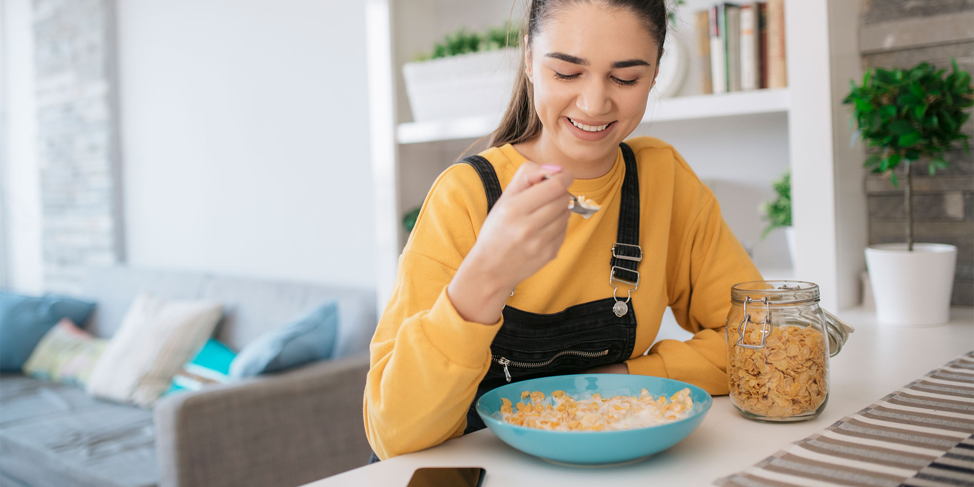 Woman eating cereal, which is often fortified with B12