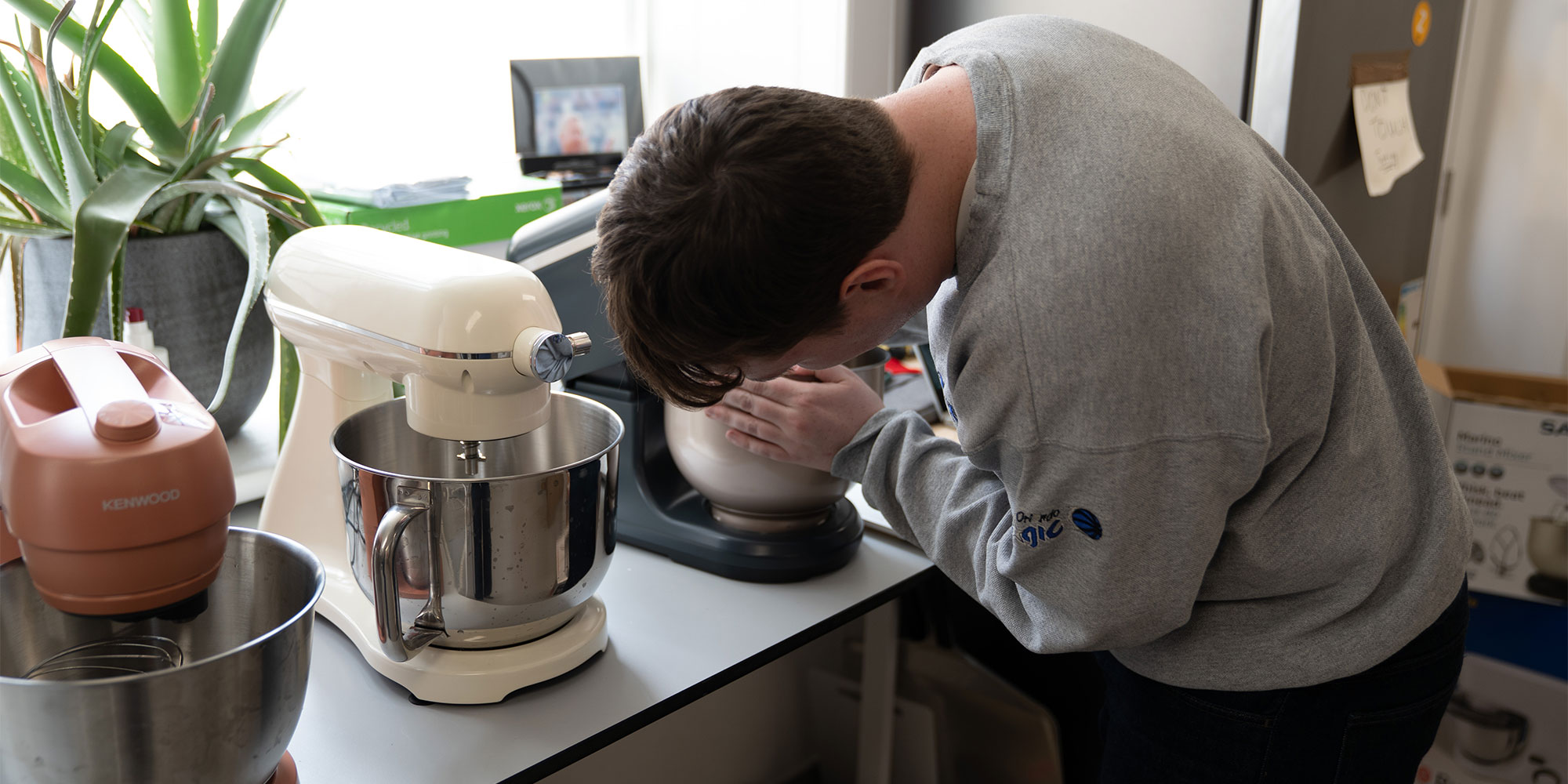 Our tester attaching the bowl to one of the mixers