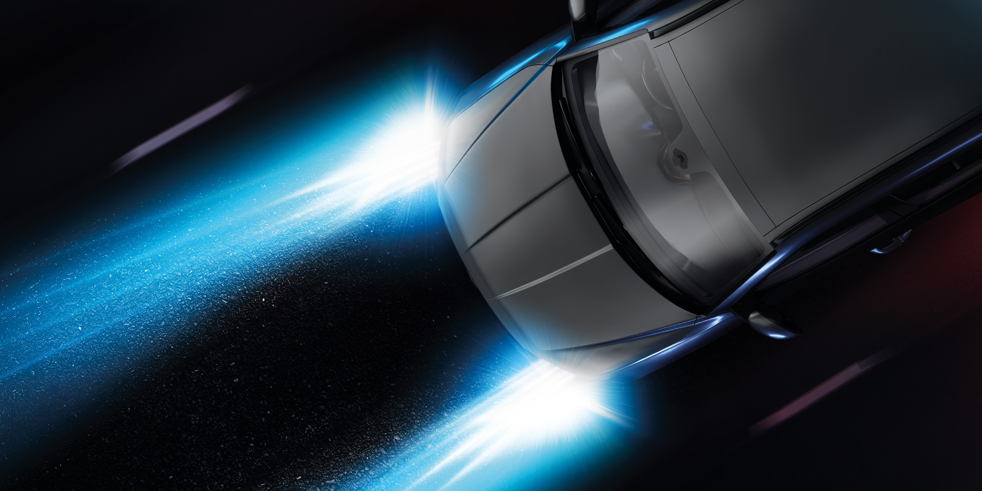 Illustration of a silver car with bright headlights shining onto a dark road
