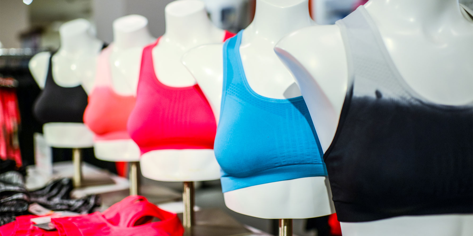 Sports bras on mannequins in a store