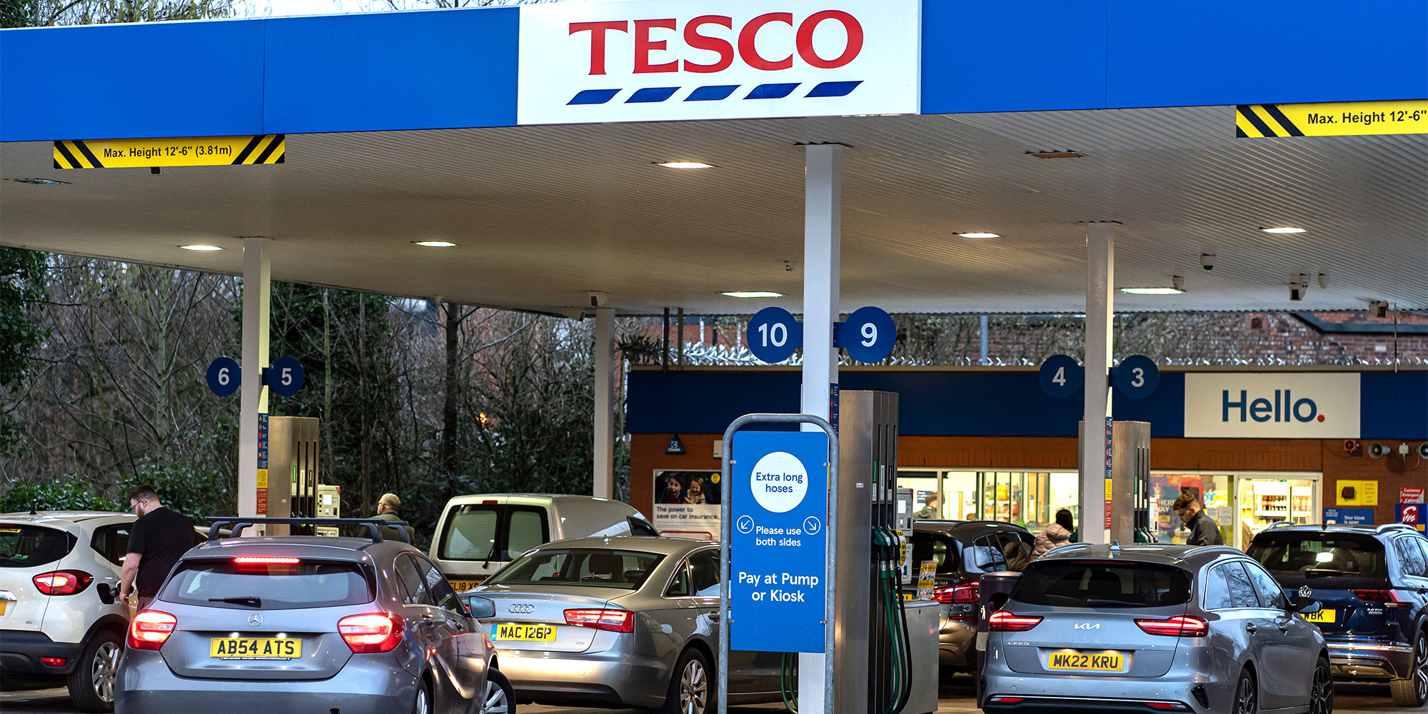 Cars queuing for petrol at a Tesco petrol station
