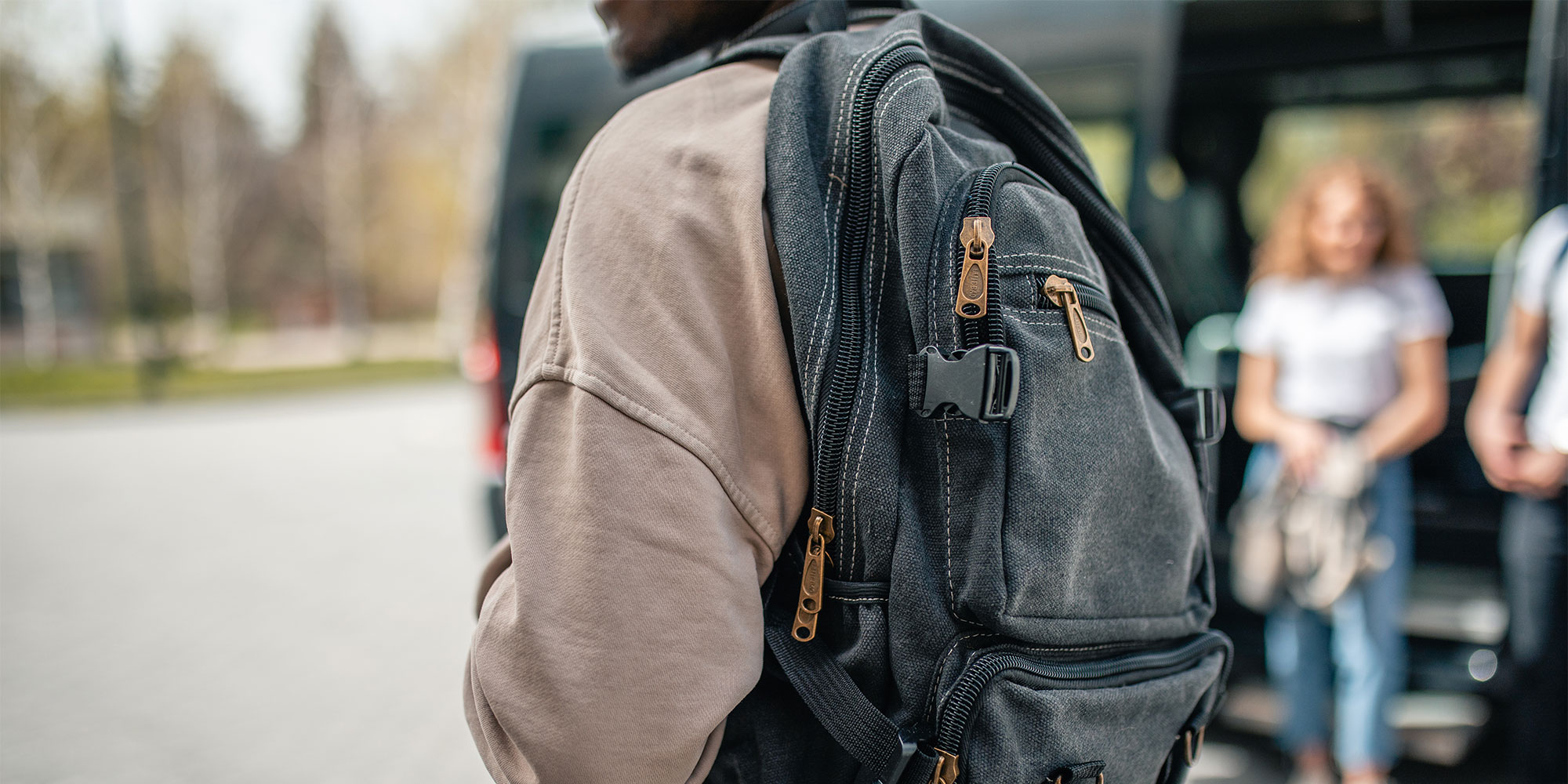A man walking around with a backpack