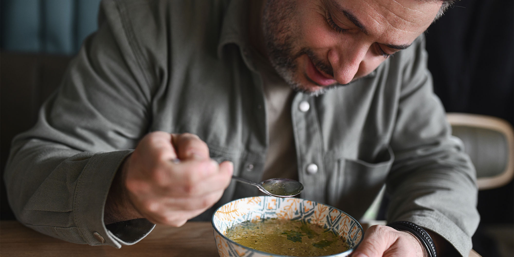 Man eating bone broth
