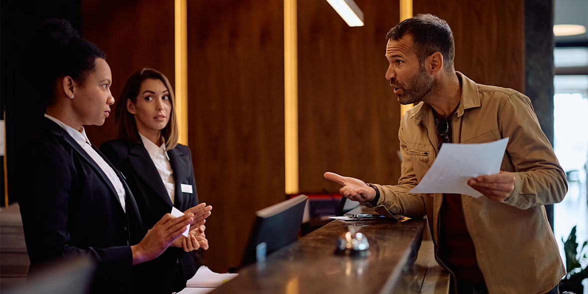Angry hotel guest at reception