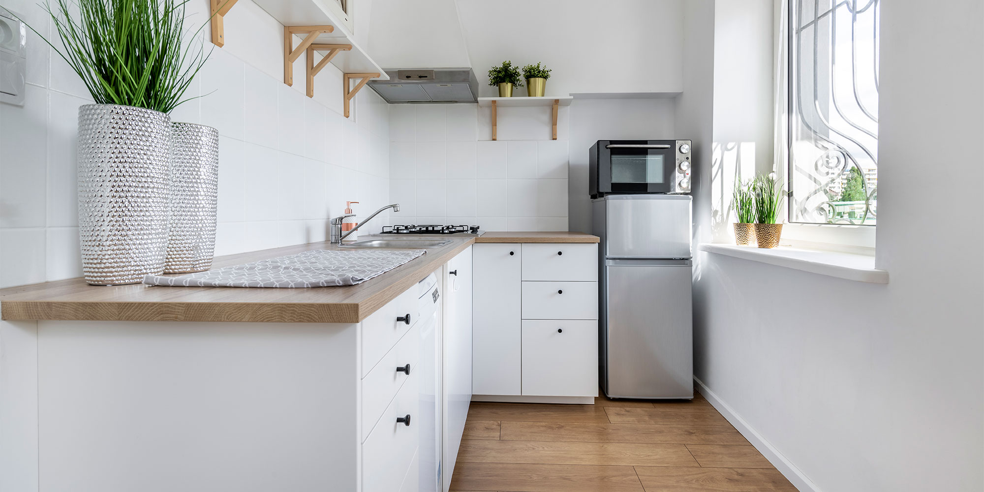 Small fridge freezer in a kitchen corner