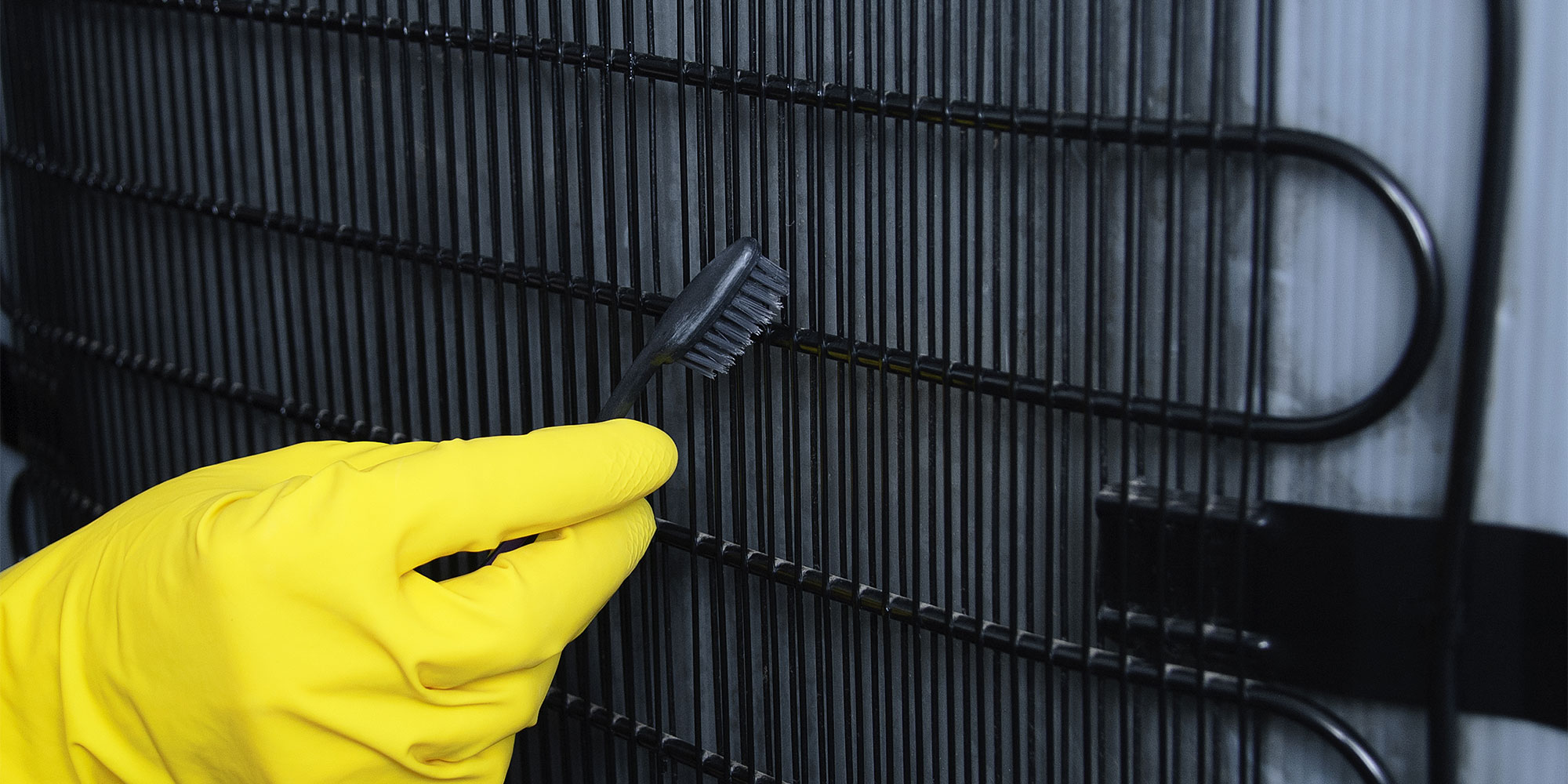 Cleaning fridge freezer condenser coils