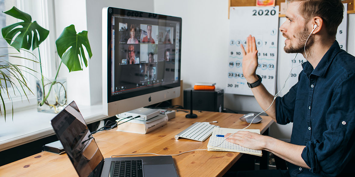 Man making a video call at his desk. 