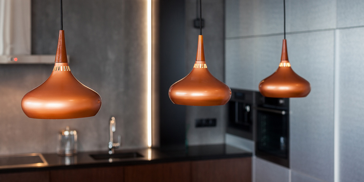 copper kitchen pendant lights in a contemporary kitchen