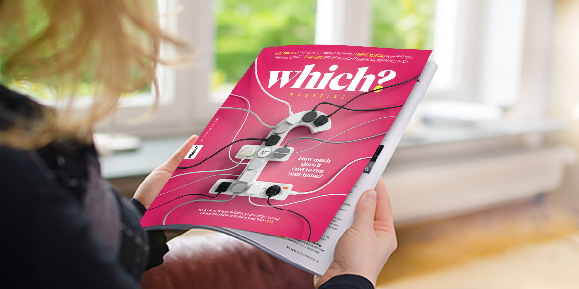 A person holding the magazine "Which?" featuring a pink cover with images of tangled cables and electronic devices.