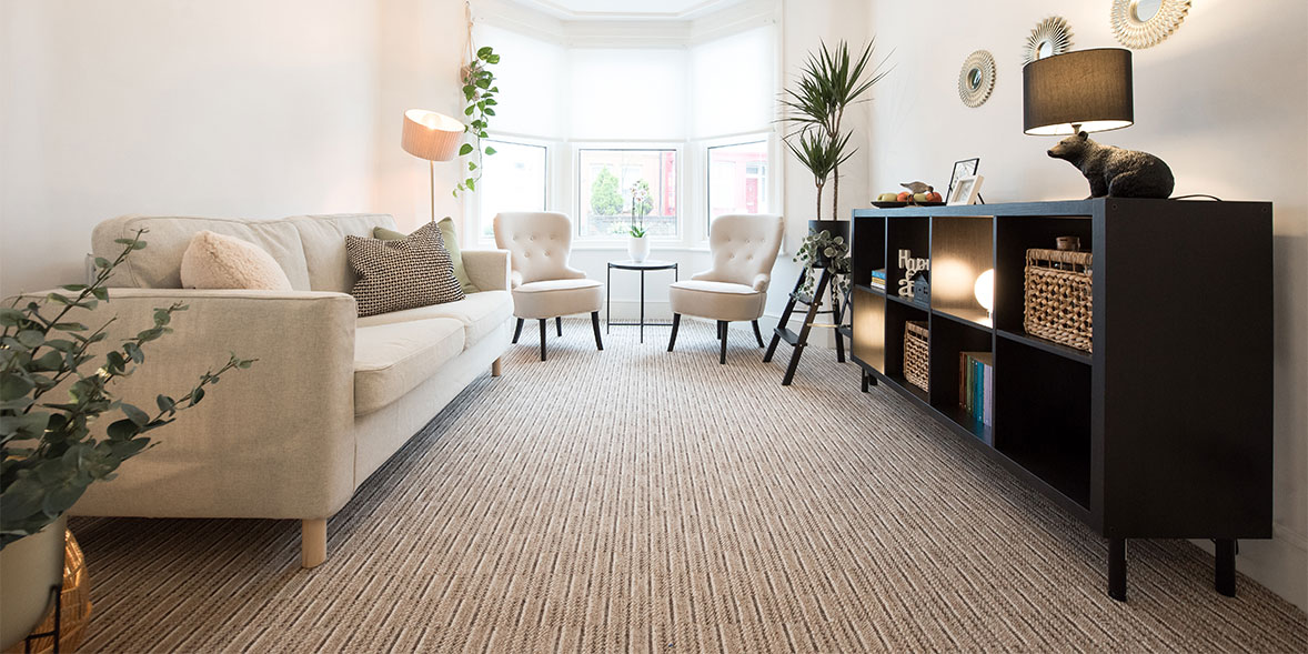Striped beige carpet in a living room
