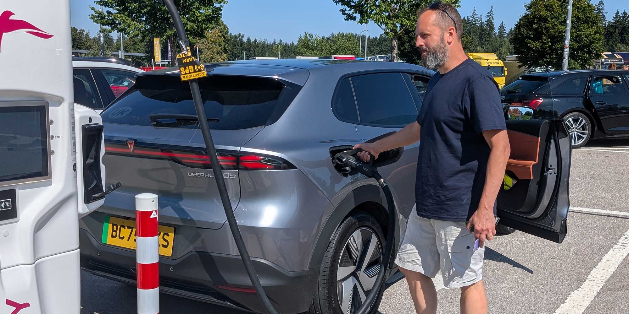 Man charging a Changan Deepal S05 electric car