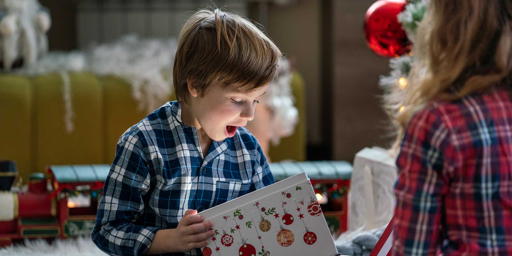 Boy opening Christmas presents