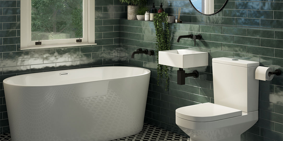 a modern bathroom suite with rustic green gloss wall tiles