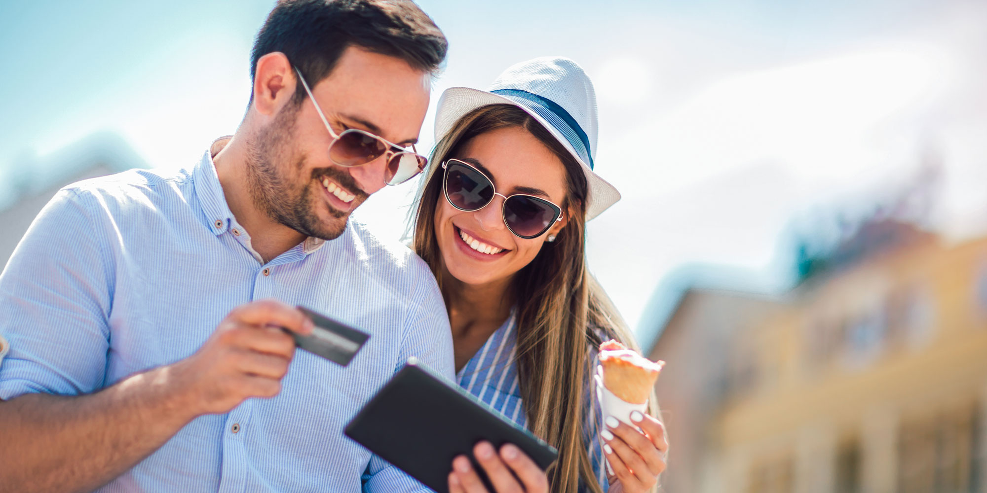 A couple pays for something on holiday