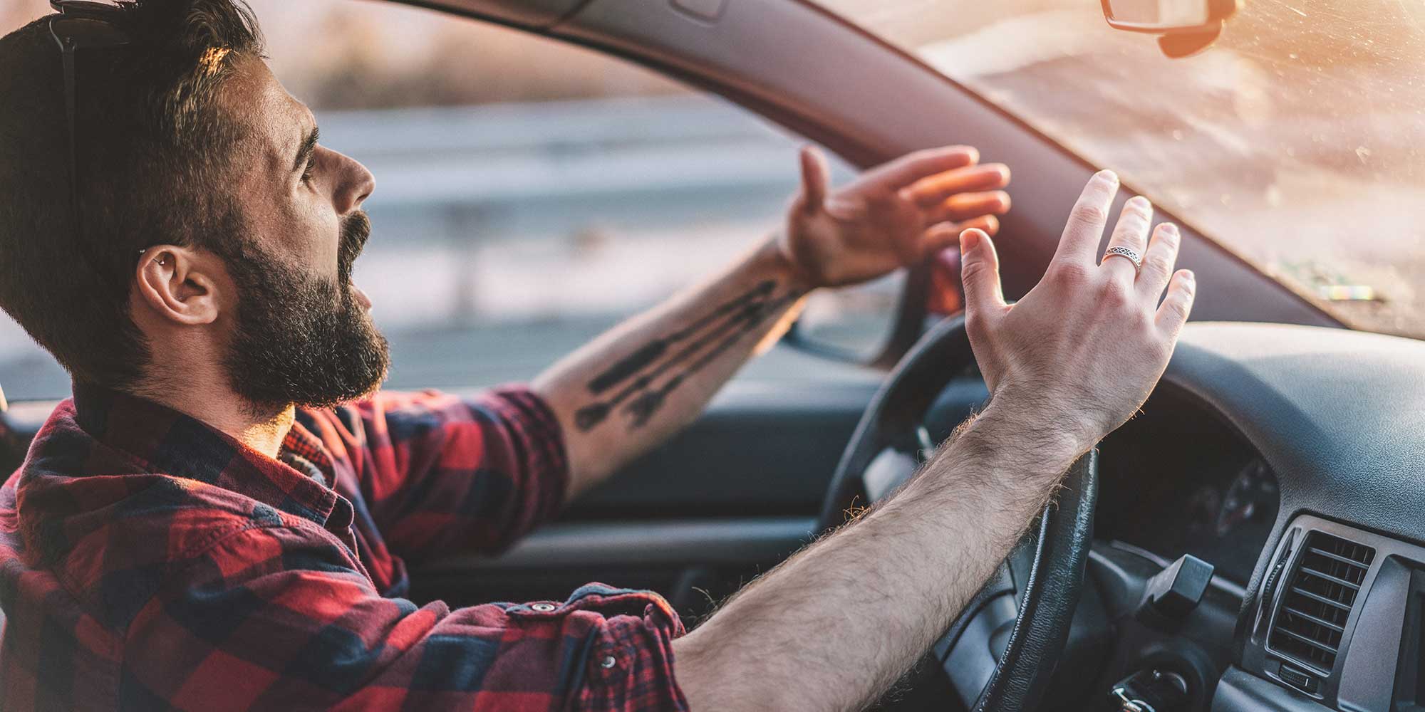 Angry man driving a car