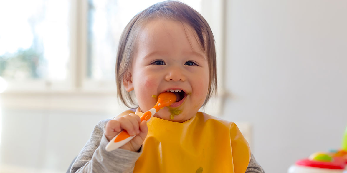 Baby eating baby food