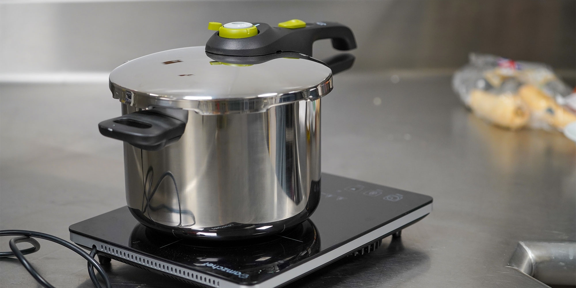 One of the pressure cookers we tested on an induction hot plate