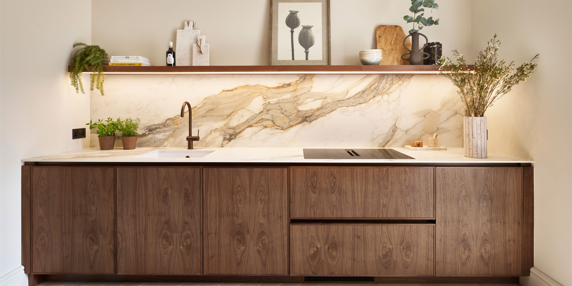 Microshaker cabinets in warm wood with marble backsplash