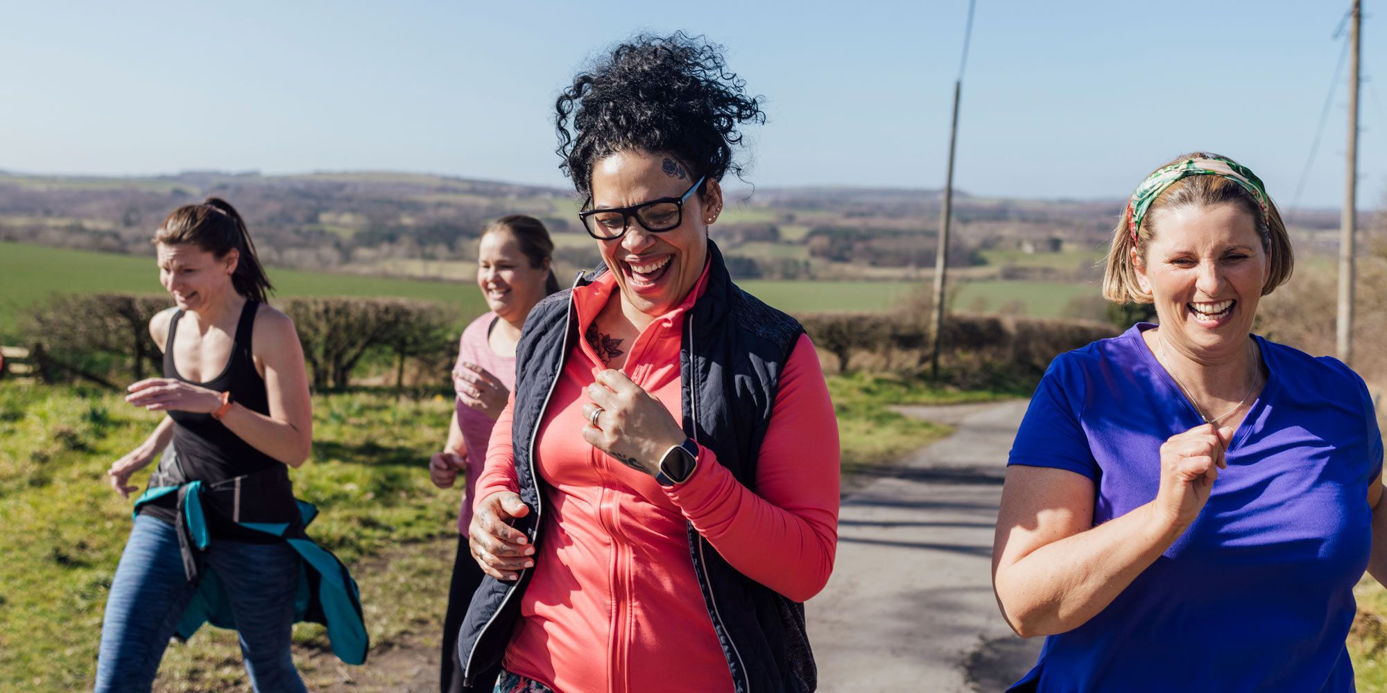 A group of women exercising outdoors together