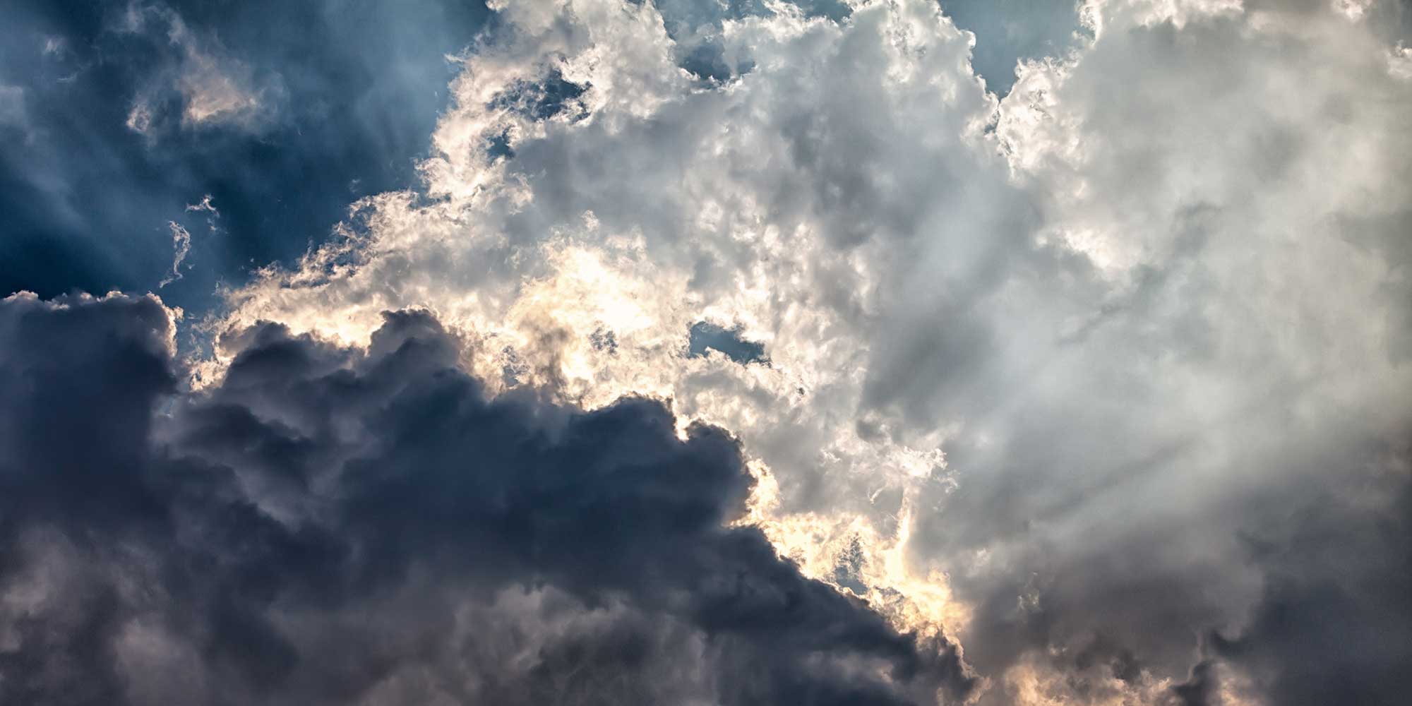 Sun showing through some clouds in the sky