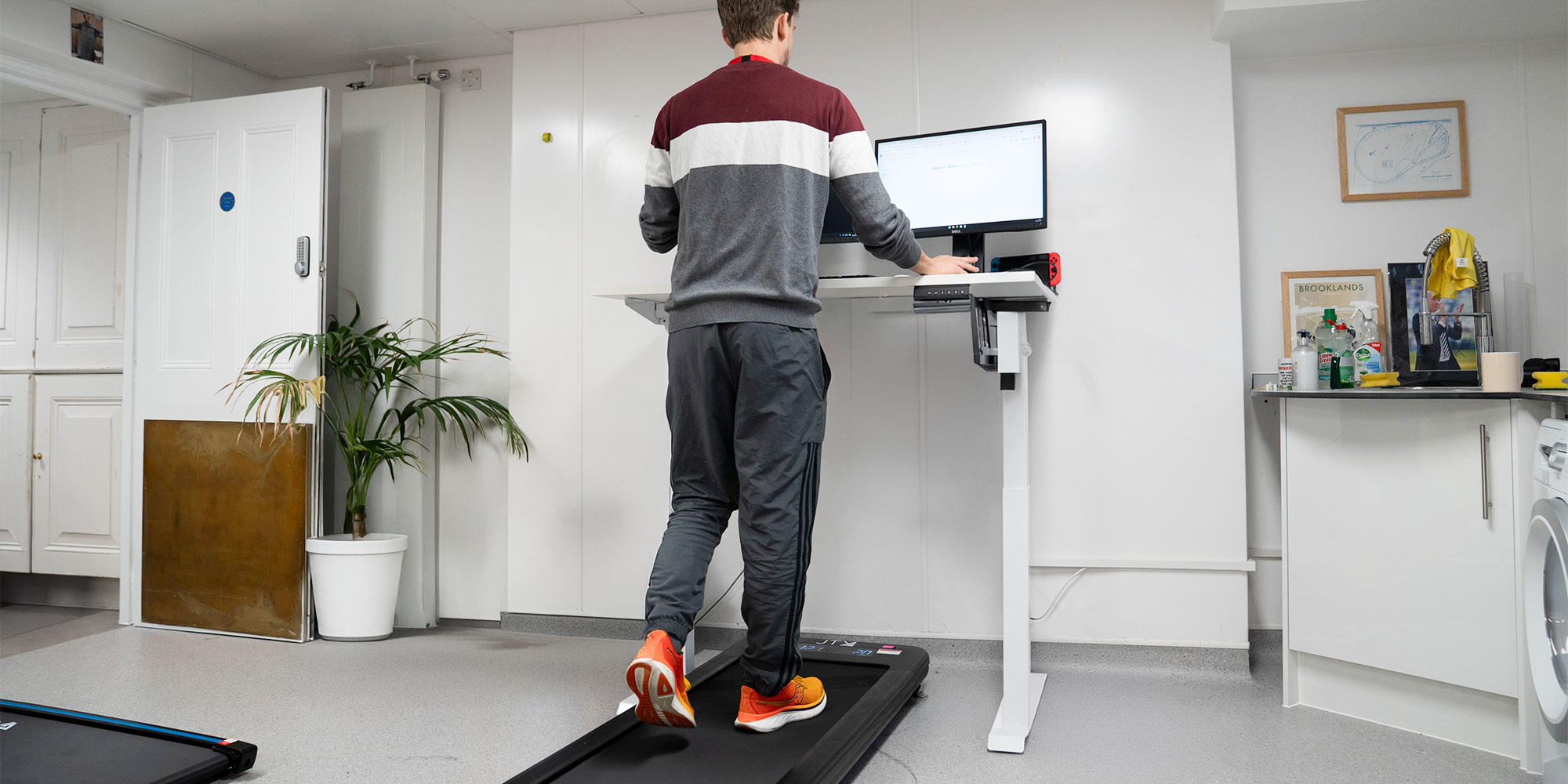 A Which? expert puts a walking pad through its paces in the dedicated testing room.
