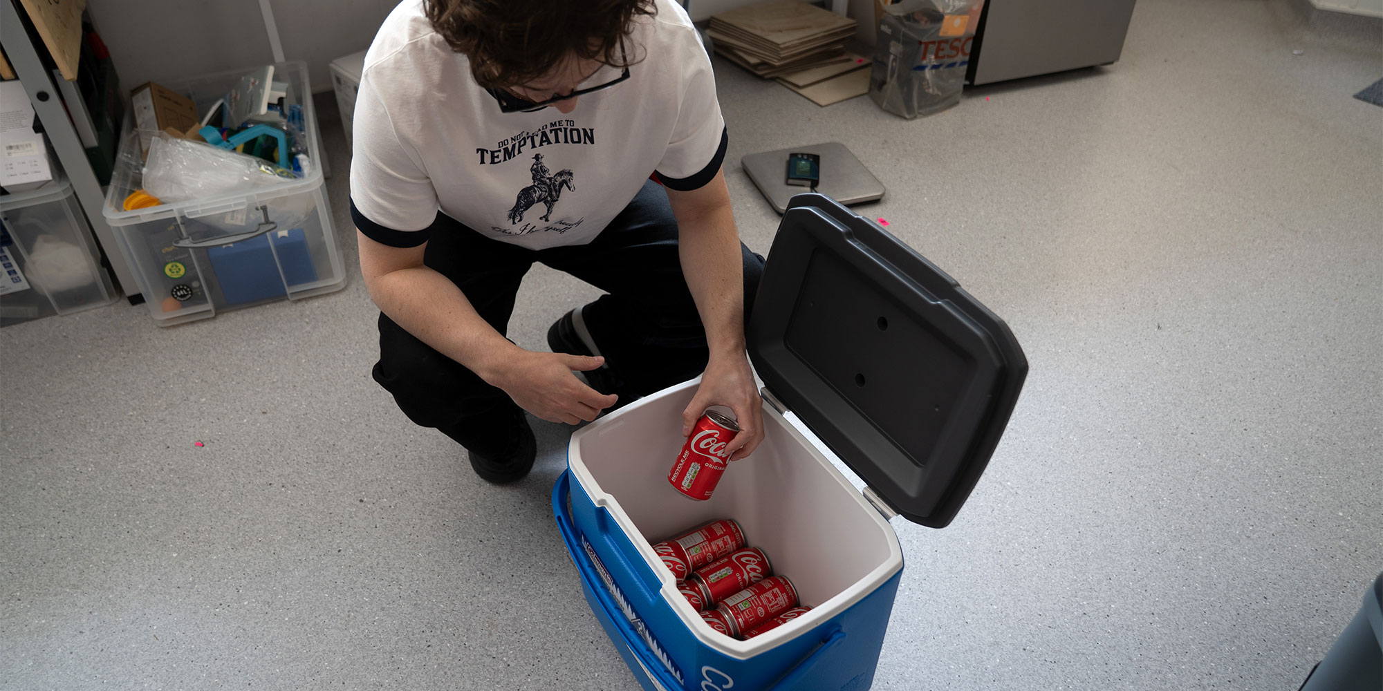 cool boxes being filled with soft drink cans
