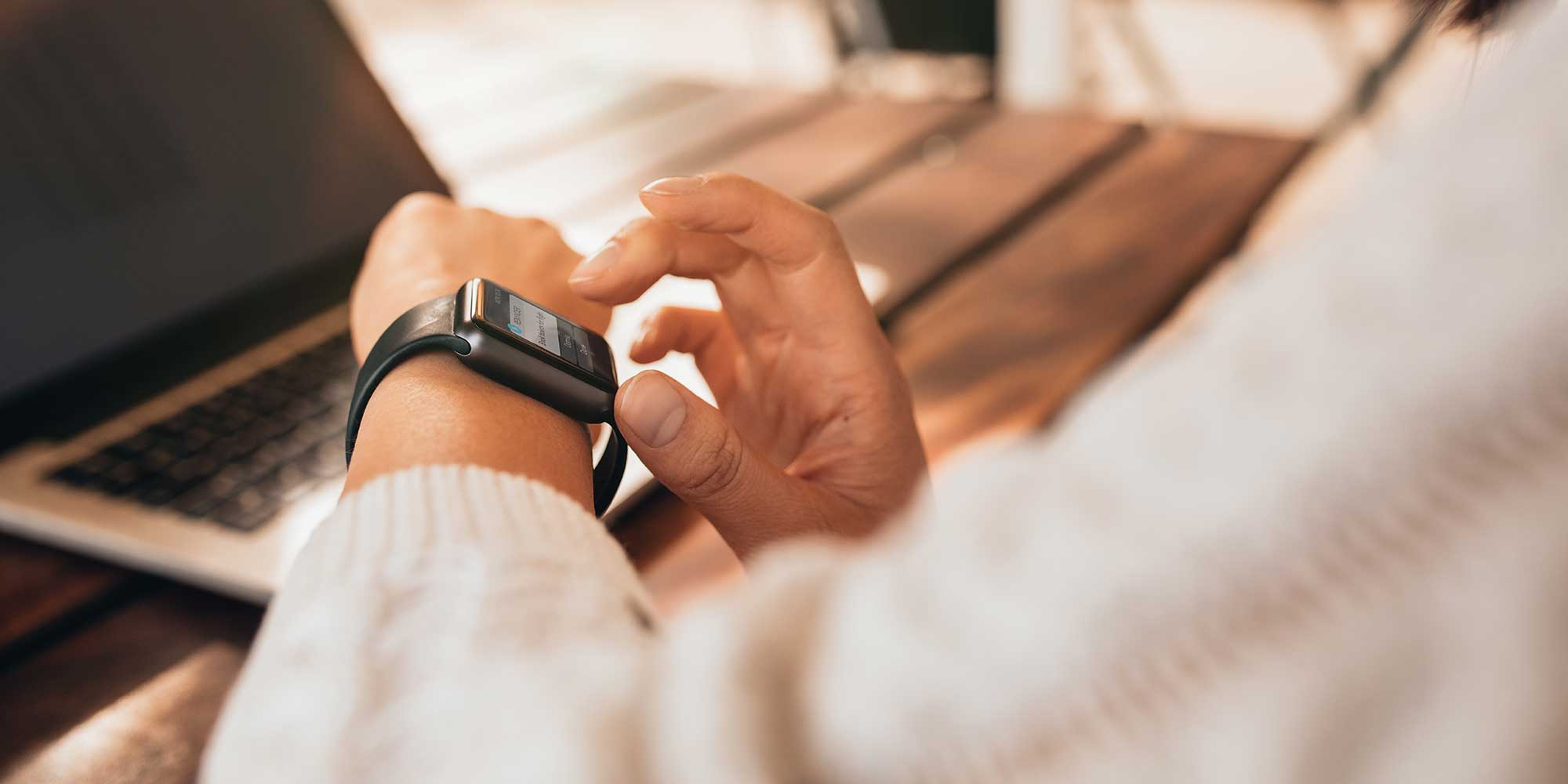 A person using their smartwatch