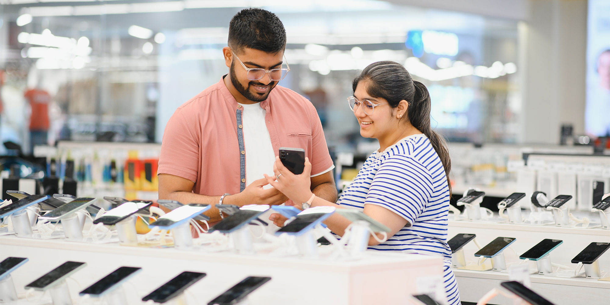 People buying a mobile phone, smarphone